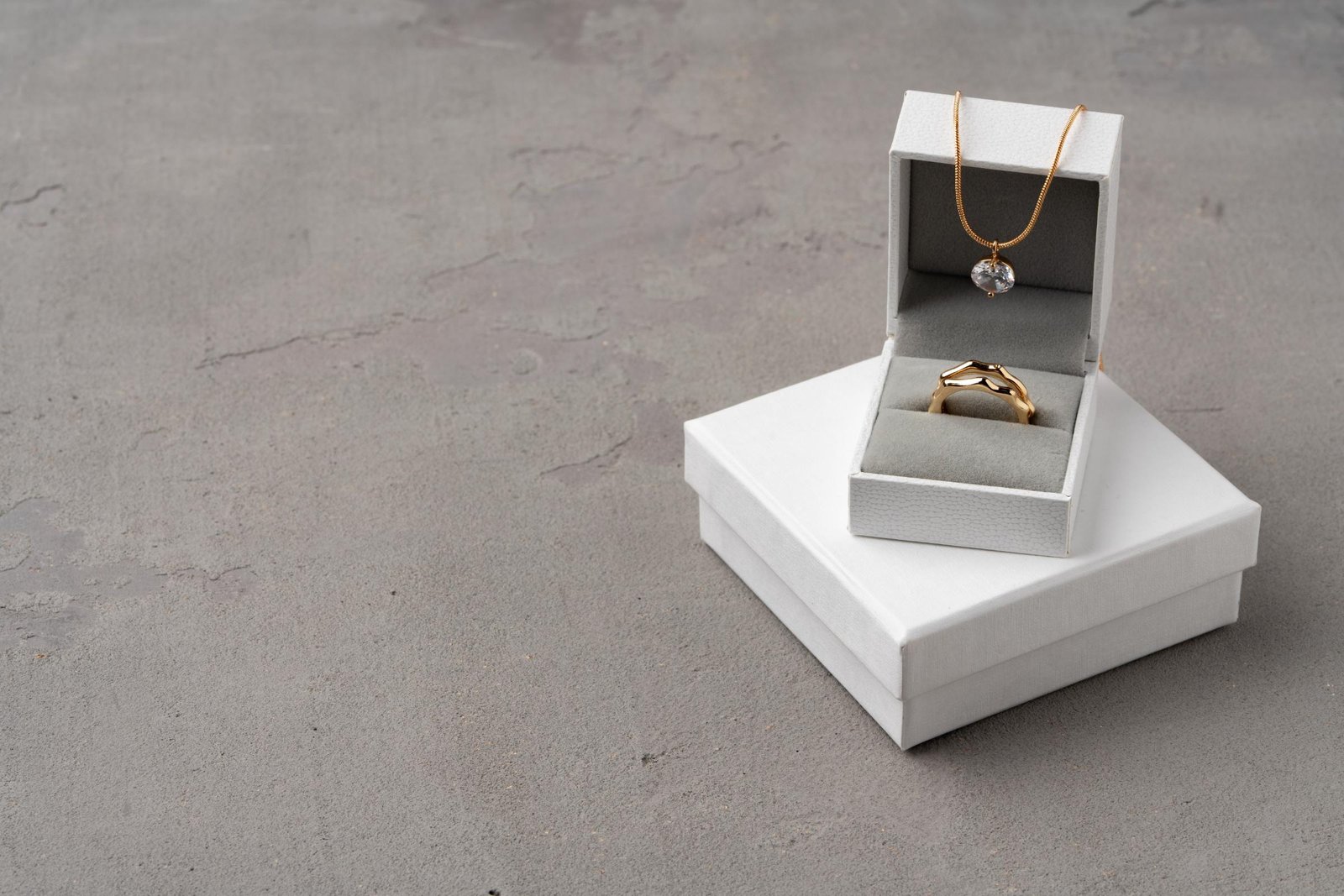 golden jewellery in box on gray background 2023 11 27 05 06 42 utc 1.jpg